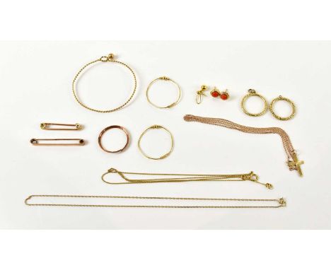 A yellow metal bar brooch stamped 9ct, a further bar brooch stamped 9c, two 9ct gold necklaces, a 9ct crucifix suspended on a