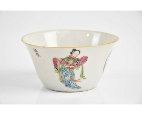 A Chinese republic famille rose tea bowl decorated with male and female in traditional dress and calligraphy, height 5cm.Cond