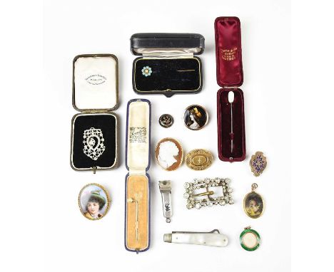 A Victorian yellow metal diamond set mourning brooch of oval form, a carved cameo brooch side profile of a maiden, three stic