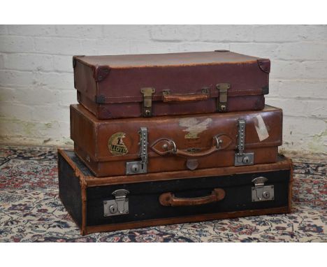 Three vintage suitcases including a Hegaro Soothill Manor example with Wakefield label from King's Cross, width 66cm, a black