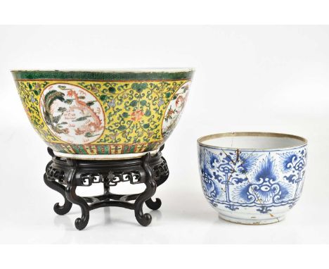 A 19th century Chinese Famille Rose Imperial yellow ground bowl, decorated with four circular panels depicting five claw drag