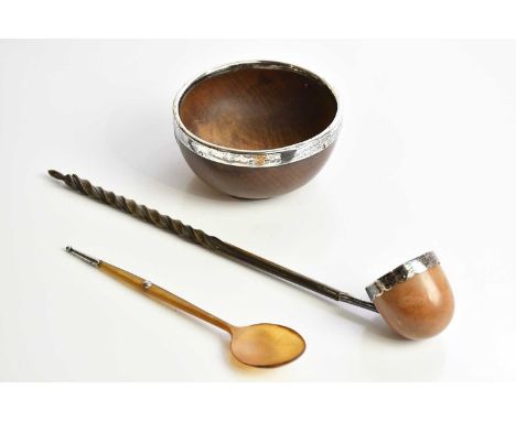 An Edwardian horn porringer spoon with white metal mounts, a horn handled ladle and a hallmarked silver rimmed turned wooden 