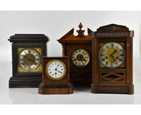 An early 20th century German ebonised mantel clock, the applied chapter ring set with Roman numerals, height 33cm, and three 