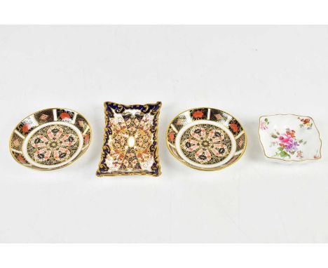 ROYAL CROWN DERBY; two boxed circular pin dishes in the 1128 pattern, a rectangular pin dish in the 2451 pattern and a furthe