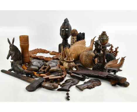 A collection of hardwood carved figures and tribal art to include bowls, stands, vases, etc.