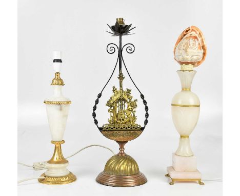 A late 19th century Arts and Crafts style cast iron, brass and copper table lamp, with lyre form surround flanking the centra