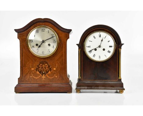 An Edwardian inlaid mahogany mantel clock, the silvered dial set with Arabic numerals, height 35cm, and a further Edwardian m