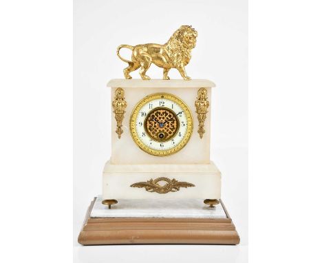 A Victorian alabaster mantel clock, with gilt metal applied lion surmount and busts above and flanking the dial set with Arab
