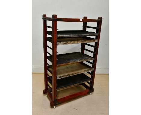A vintage stained pine metal-bound trolley with assorted trays, width 86cm, depth 46cm, height 152cm. 
