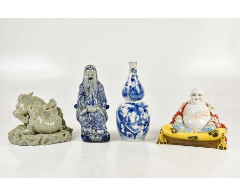 A 19th century Chinese blue and white double gourd vase decorated with figures, bears four character Kangxi mark to the under