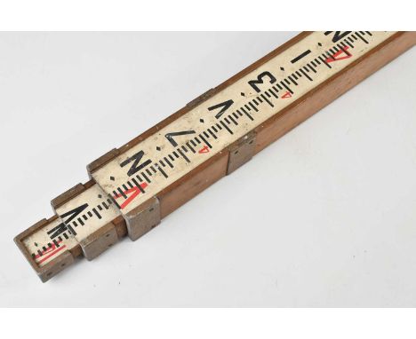 A vintage triple extending mahogany cased measuring rod, length when extended 416cm