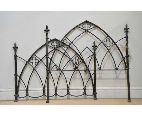 A reproduction cast metal Gothic style double bedstead.