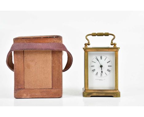 A late 19th century French brass cased carriage clock, the enamel dial set with Roman numerals and stamped 'Evershed &amp; So