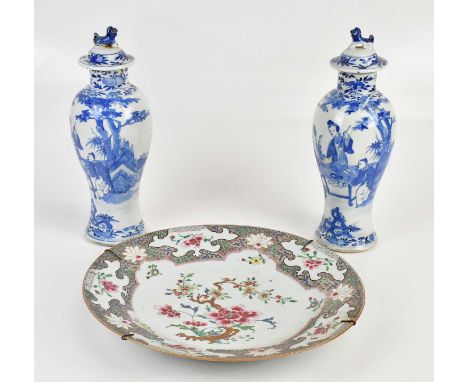 A pair of late 19th century Chinese blue and white porcelain jars and covers decorated with figures, bearing Kangxi double ri