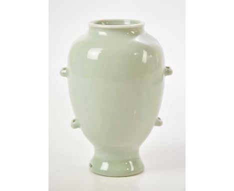 A Chinese porcelain celadon glazed lantern vase, bearing Yongzheng mark to base, height 13.5cm.Condition Report: Firing/hairl