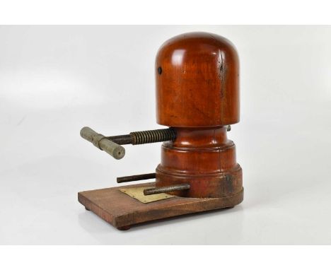 A vintage treen hat stretcher on stand, height 34cm. 