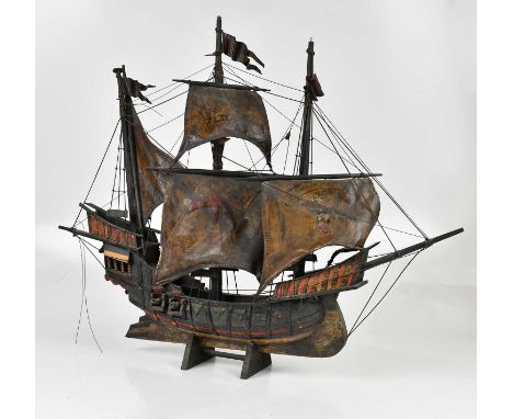 A decorative wooden model of a ship, height 67cm.