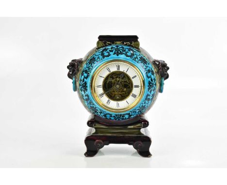 ATTRIBUTED TO BORDEAUX VIEILLARD; a French chinoiserie decorated majolica Arts and Crafts mantel clock, with moulded mask hea