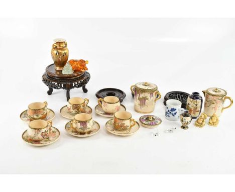 A circa 1800 Chinese blue and white export ware mug with floral decoration, Japanese Satsuma items, modern netsukes, an amber