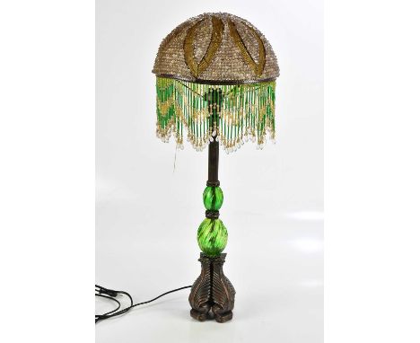 A modern green glass and copper lamp, with beadwork shade, height 70cm.Condition Report: The item or items in this lot are so