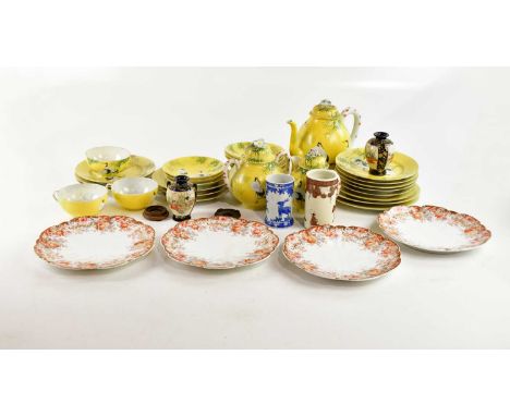 A Japanese eggshell porcelain part tea service, decorated with cranes and bamboo on a yellow ground (qty).