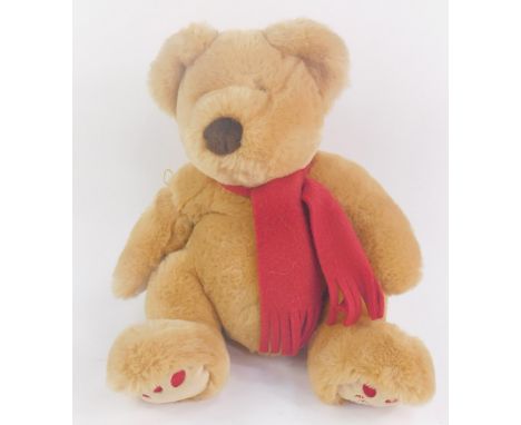 A Fraser Bear 2000, modelled wearing a red felt scarf, 39cm high.