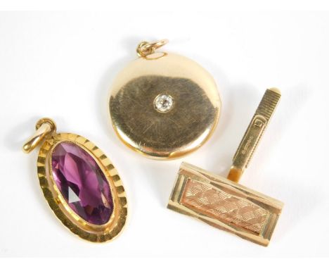 A Victorian 15ct gold and diamond inset circular photo locket, 6.1g, together with a 9ct gold cufflink, 4.2g, and a Continent