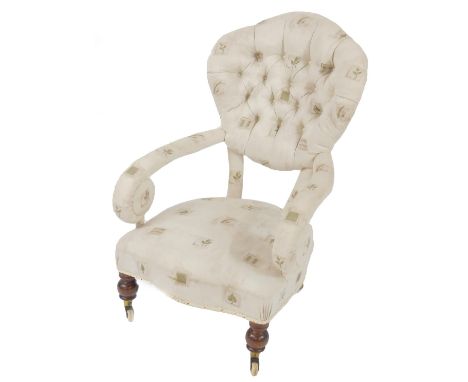 A Victorian cameo back nursing chair, with patterned button back upholstery and serpentine overstuffed seat, raised on turned