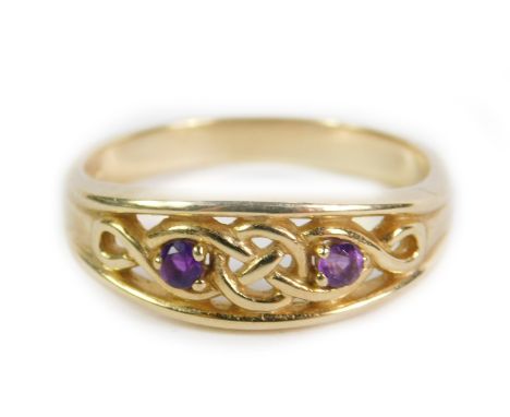 A 9ct gold and amethyst two stone ring, in a Celtic knot design, size T, 3.7g.