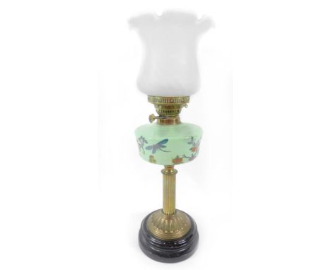 A Sherwood's Ltd of Birmingham brass oil lamp, with a green glass reservoir over painted with dragonflies and fruit, raised o
