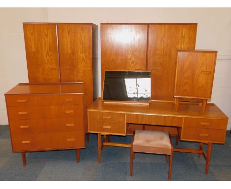 A Gimson &amp; Slater Vesper teak bedroom suite, comprising a dressing table with central jewellery drawer flanked by two pai