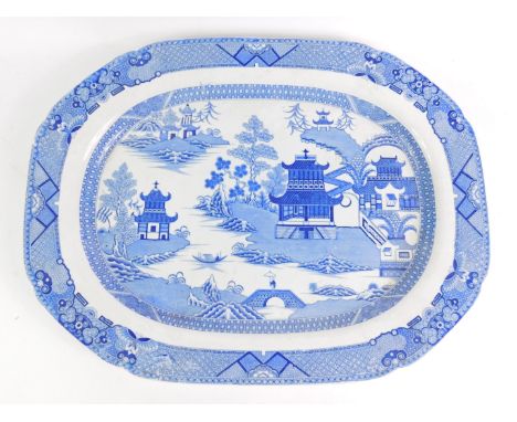 An early 19thC Spode blue and white transfer decorated meat platter, chinoiserie decorated with pagodas, a river landscape an