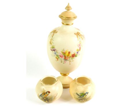 A pair of Royal Worcester porcelain vases, C1905, of spiral form, decorated with birds, gilt heightened, printed marks, toget