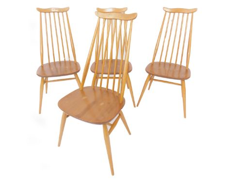 A set of four Ercol light elm and beech stick and rail back dining chairs, raised on turned legs, united by an H framed stret