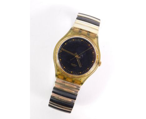 A Swatch gentleman's wristwatch, on a green/yellow plastic watch head, with expanding black and silver stainless steel bracel