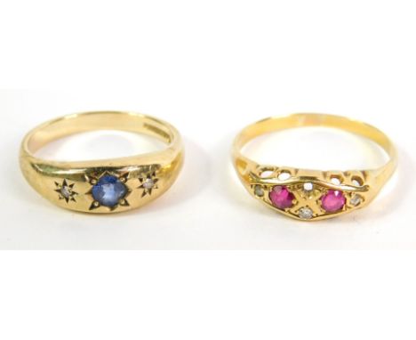 An 18ct gold ruby and diamond ring, one diamond lacking, size R/S, 2.4g, together with a 9ct gold aquamarine and diamond thre