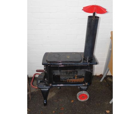 A German enamelled cast iron chestnut roaster, with tools, 85cm long.