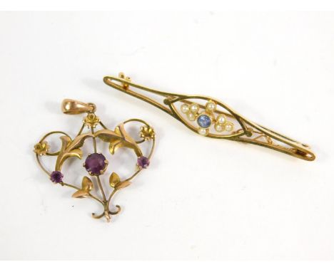 An Edwardian 15ct gold aquamarine and seed pearl set floral bar brooch, together with a 9ct gold and amethyst floral pendant,