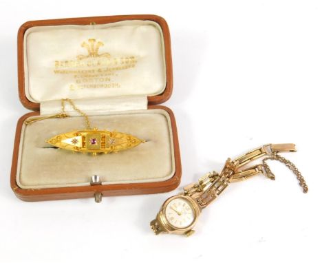 A Victorian 15ct gold ruby and diamond set brooch, with safety chain as fitted, 3.2g, together with an Avia 9ct gold circular