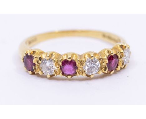 A ruby and diamond five stone 18ct gold ring, comprising round mixed cut rubies and round brilliant cut diamonds, total diamo