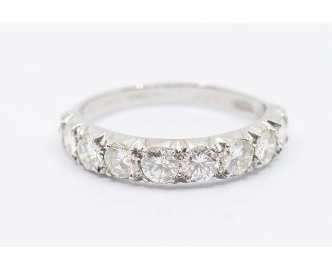 A diamond and 18ct white gold half eternity ring, comprising eight round brilliant cut diamonds, total diamond weight approx 