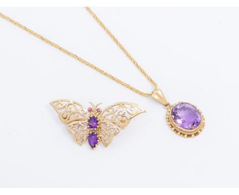 A 9ct gold and amethyst pendant, oval cut amethyst within a ridged gold border, approx 22 x 12mm inc bale, on a fancy 9ct gol