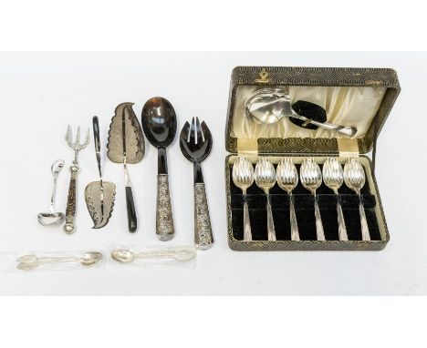 A collection of Middle Eastern white metal to include a pair of polished horn / simulant servers with ornate handles together