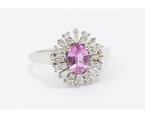 A pink sapphire and diamond 18ct white gold ring by Iliana, comprising a claw set oval cut pink sapphire to the centre approx