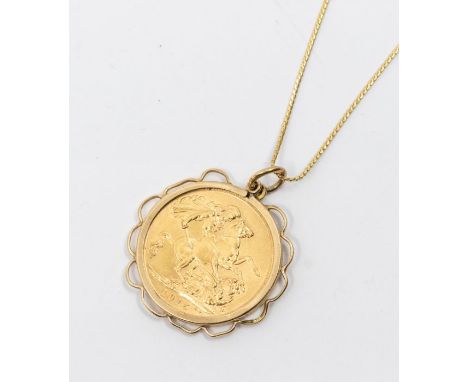 A George V sovereign dated 1915, within a fancy unmarked gold mount, (some damage to mount) on a fine link 18ct gold chain, l
