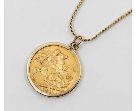 A George V full sovereign dated 1912 within a 9ct gold mount on a 9ct gold  fancy link chain, length approx 45cm, total combi