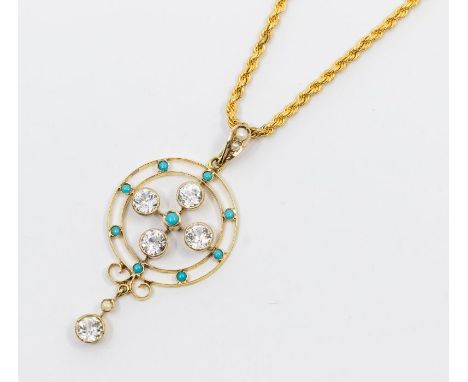 An Edwardian white sapphire and turquoise set 9ct gold pendant, comprising a circular target open work pendant set with a qua