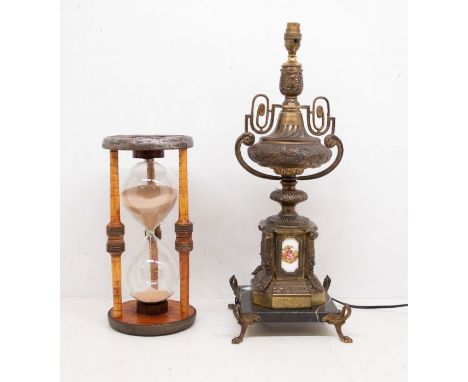 Brass and marble lamp on a stand, along with an egg timer.