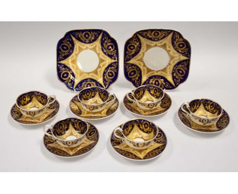 A set of six early 19th Century Spode teacups and saucers, together with two serving plates, cobalt blue ground decorated wit