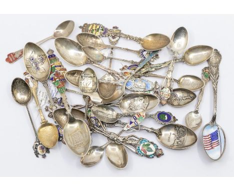 A collection of 20th Century Continental silver souvenir spoons, all with enamelled decoration and depicting various designs/